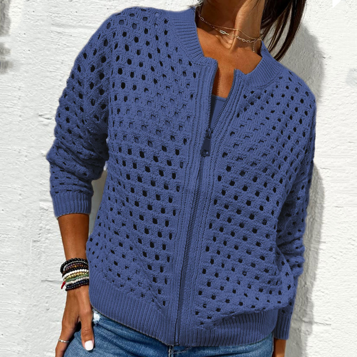 Blue open-knit zip-up cardigan styled with jeans