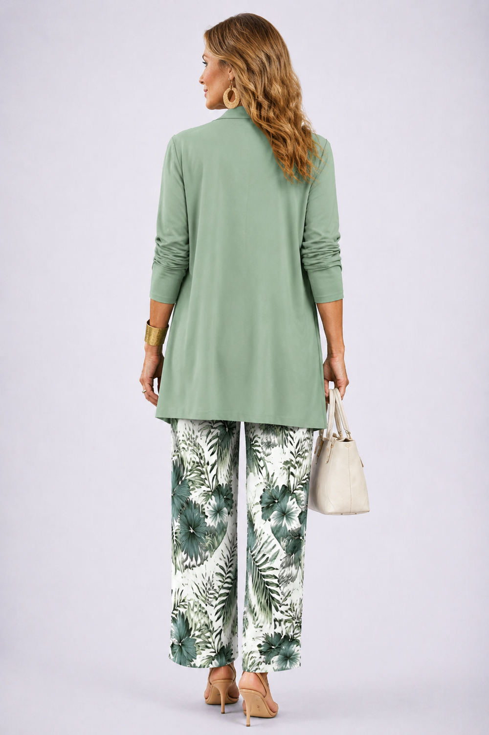 Back view of the sage and white open-front cardigan and tropical print pant set