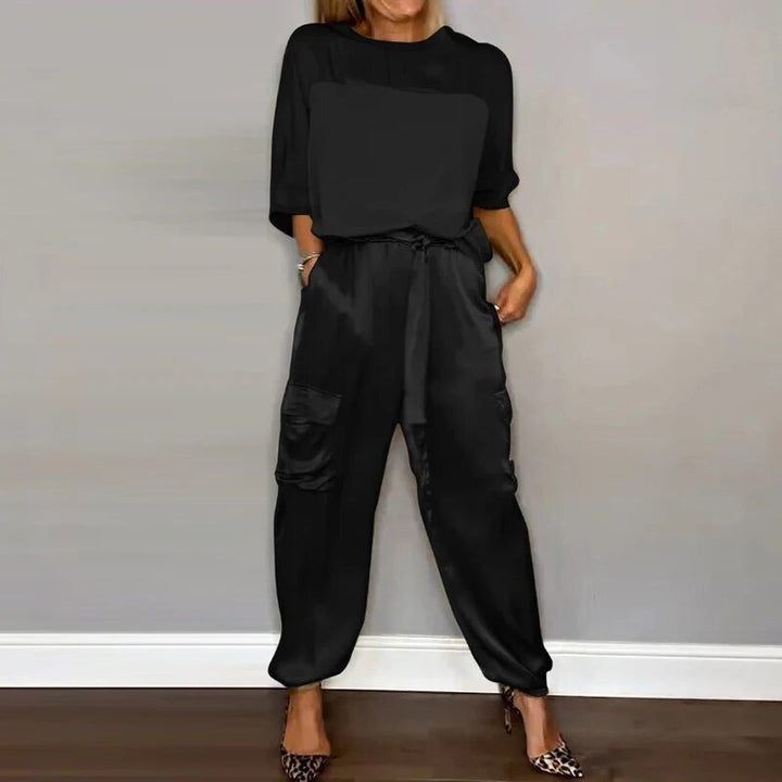 Women's black silky short-sleeve top and belted cargo pant set