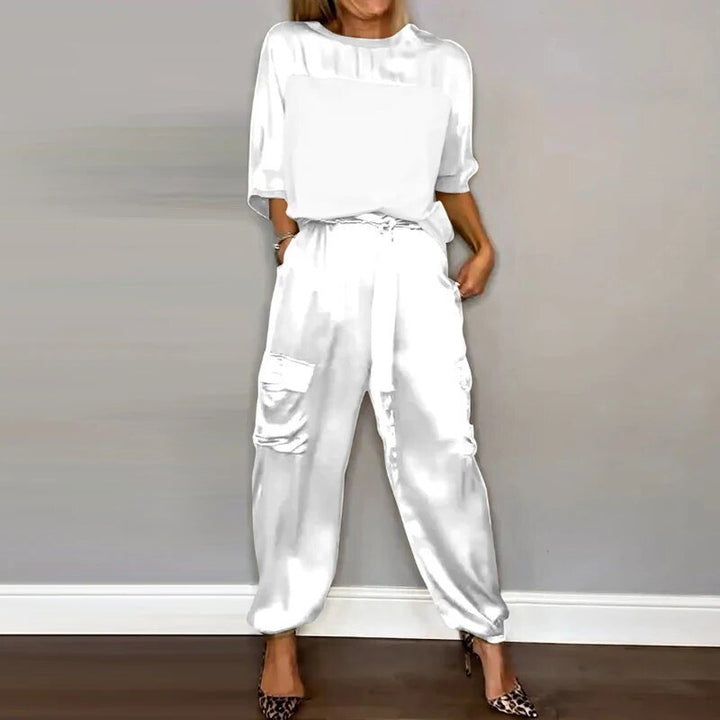 Women's white silky short-sleeve top and belted cargo pant set
