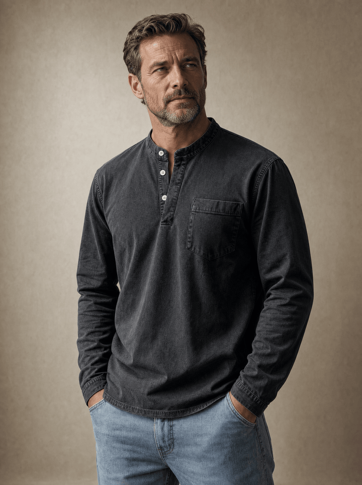 Man wearing charcoal long sleeve henley with jeans