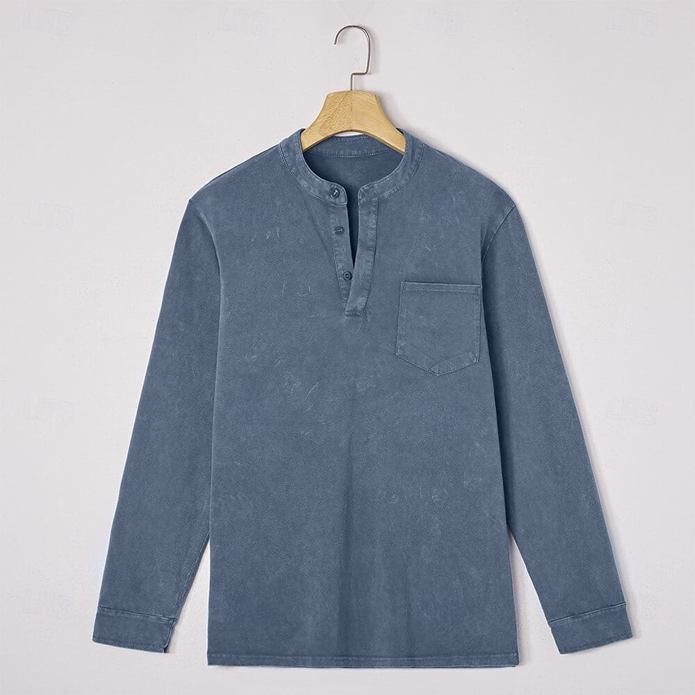Denim blue henley with chest pocket on a hanger