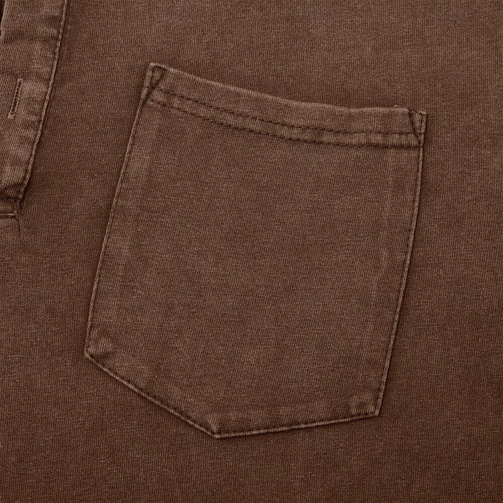 Close-up of brown henley chest pocket