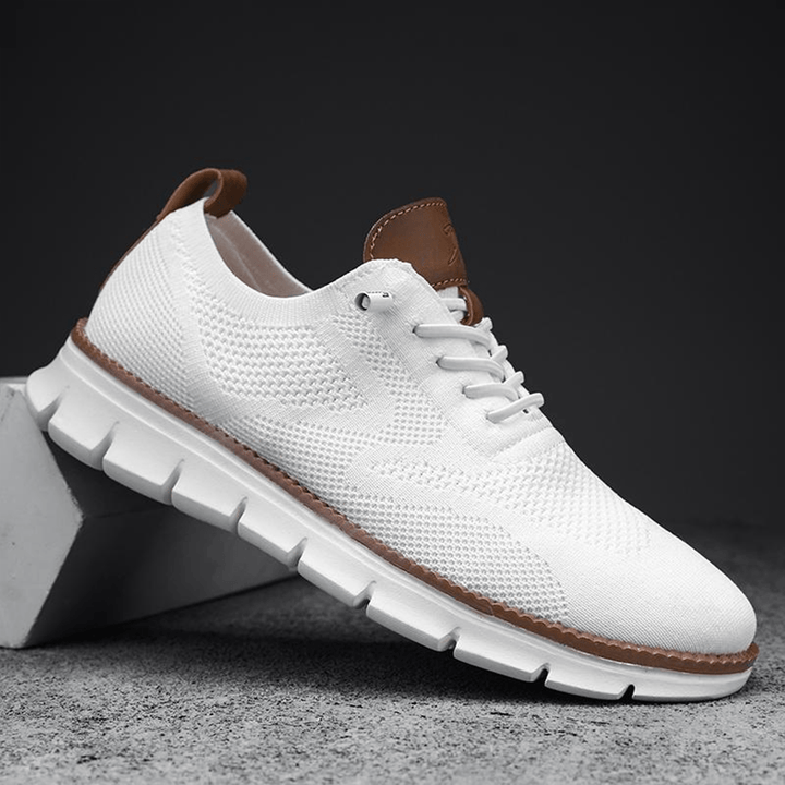 White knit sneaker with cushioned sole, side view