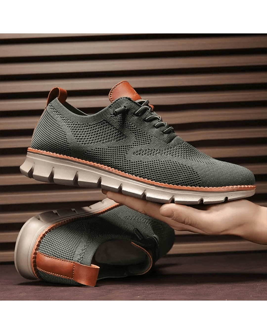 Olive knit sneakers held in hand
