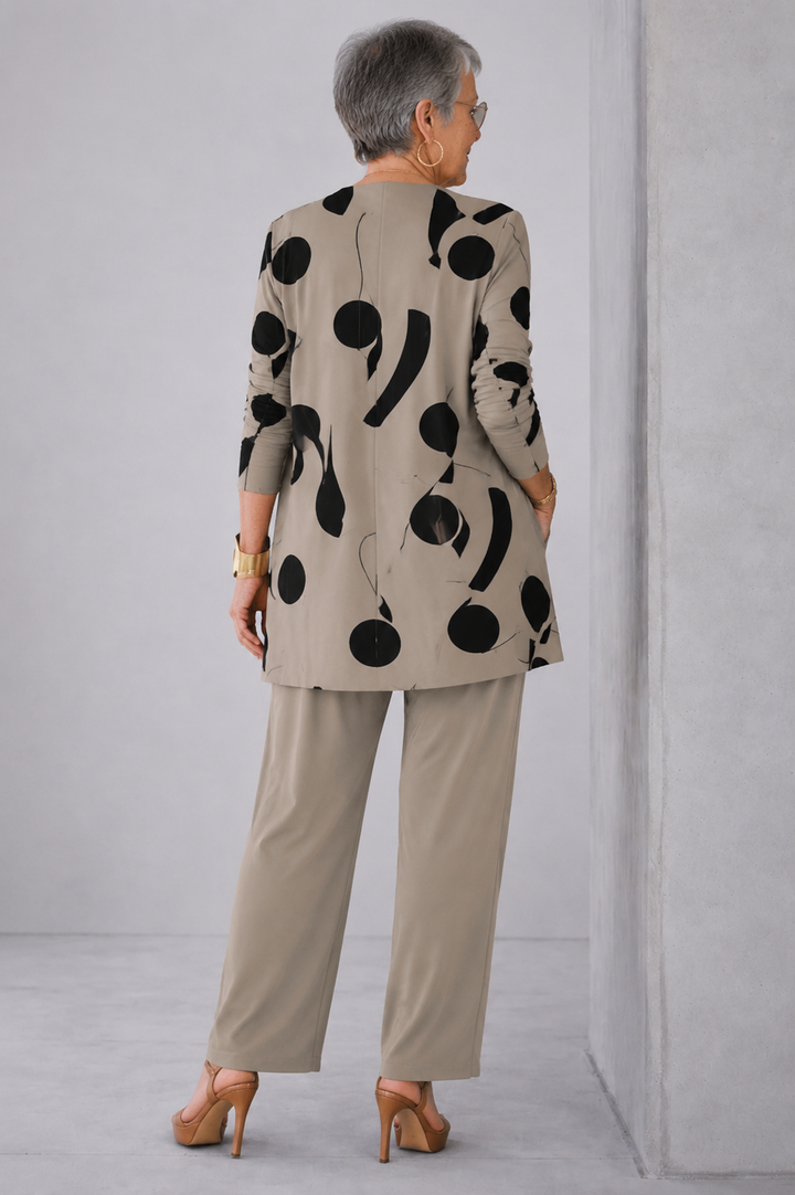 Back view of the taupe and black dot print cardigan and pant set