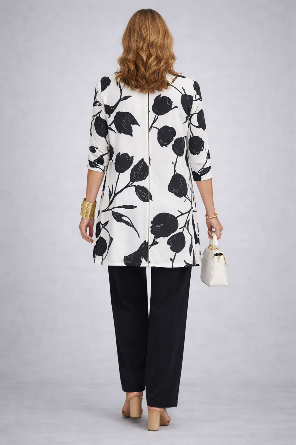 Back view of the black and white floral print cardigan and pant set