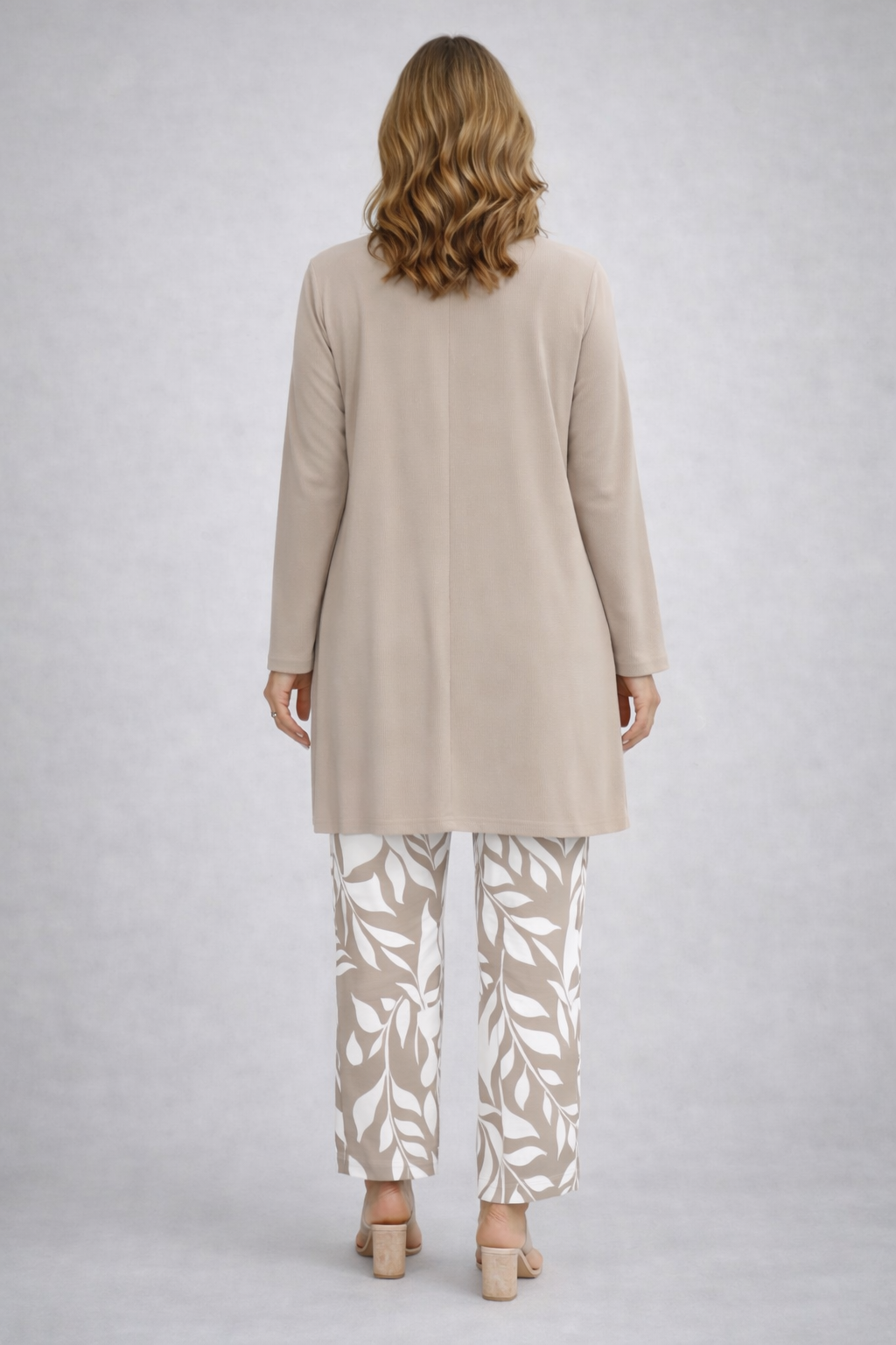 Back view of the taupe and white open-front cardigan and leaf print pant set