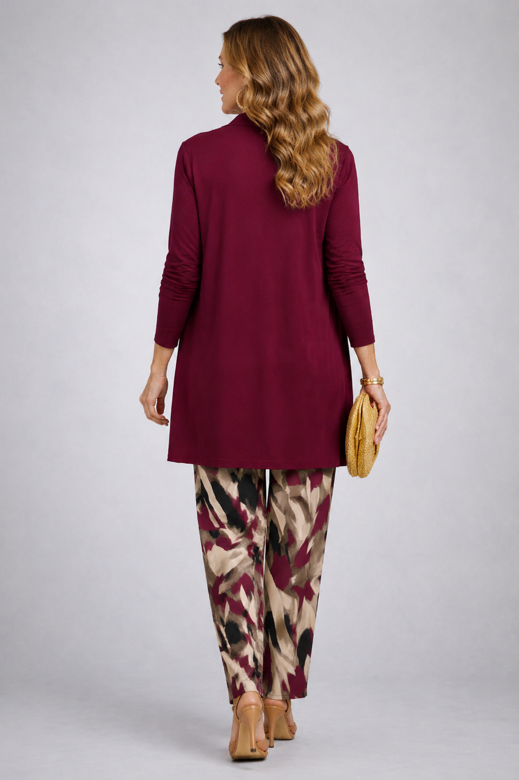 Another view of the burgundy open-front cardigan and abstract print pant set