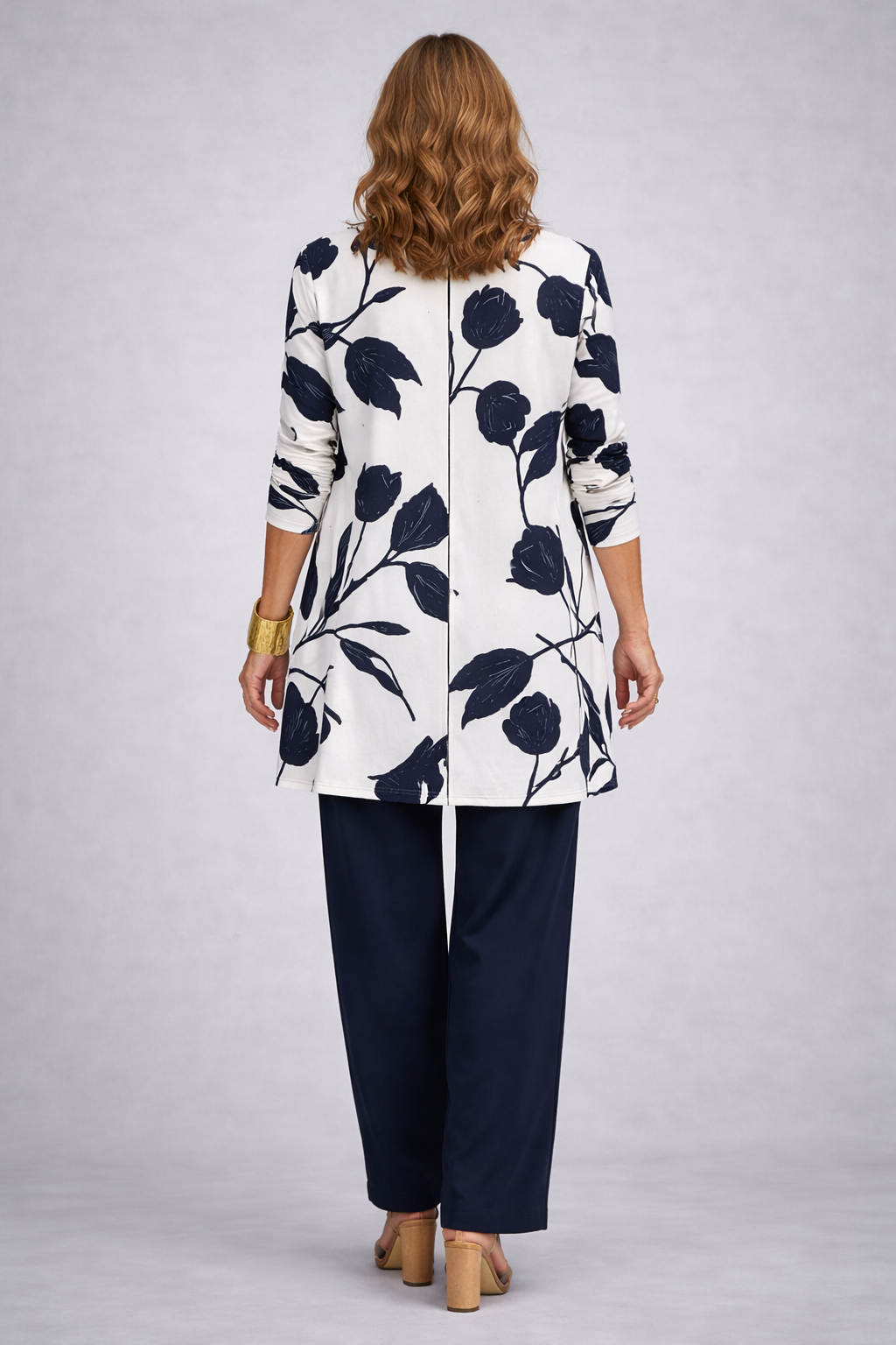 Back view of the navy and white leaf print cardigan and pant set