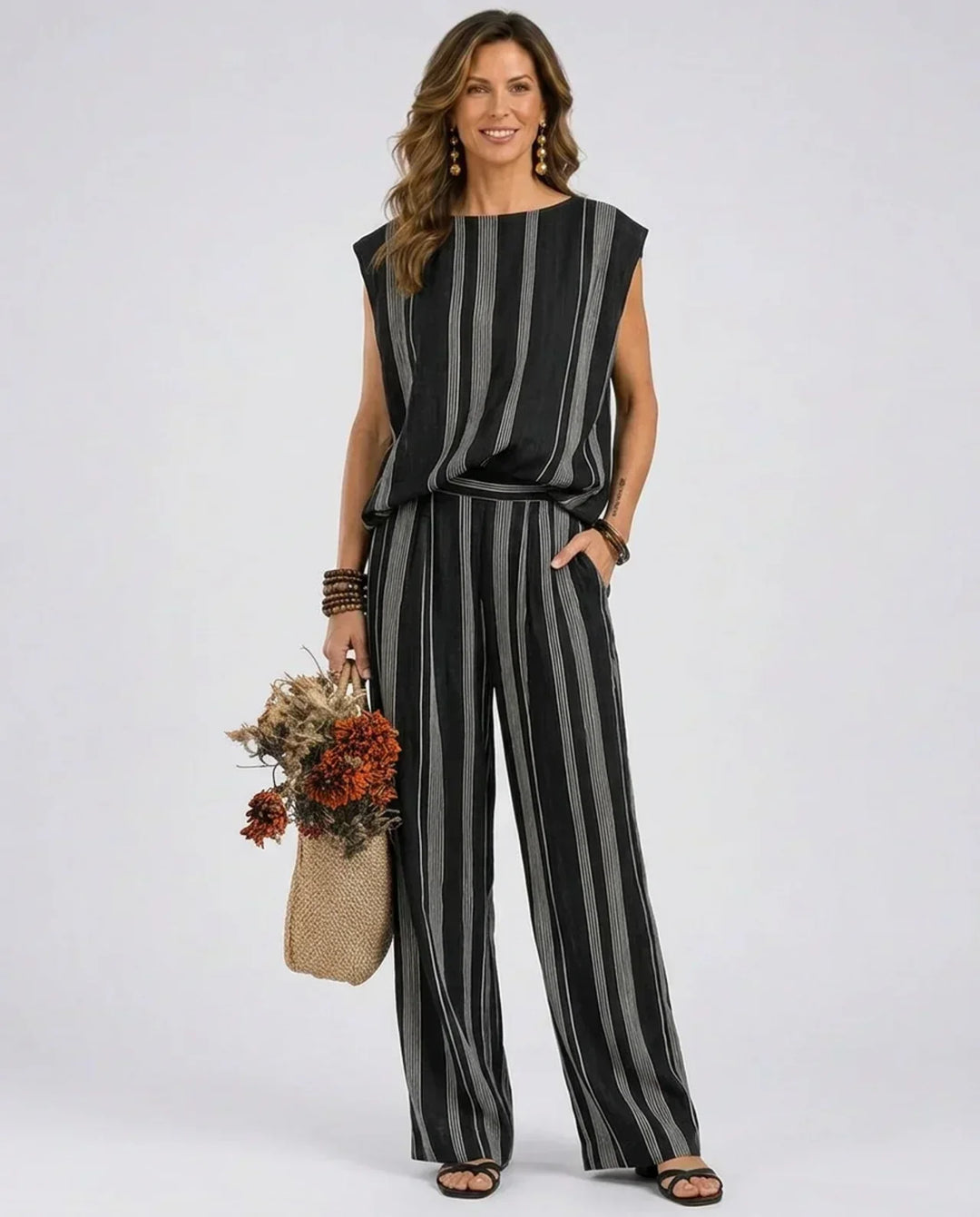 Women's black and gray striped sleeveless top and wide-leg pant set