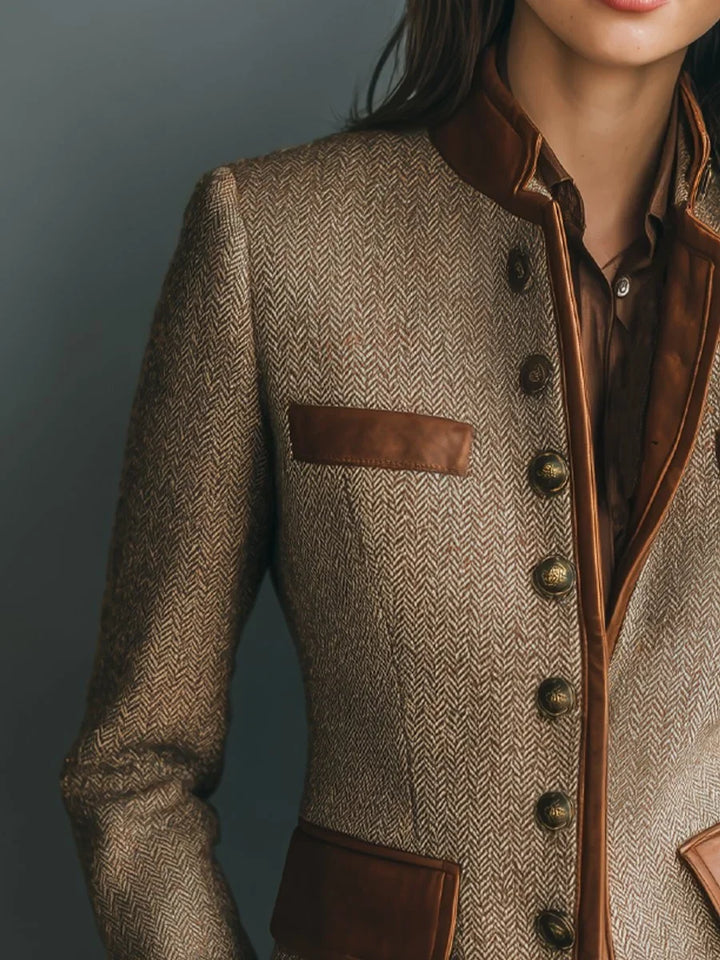 Close-up of herringbone jacket with bronze-tone buttons