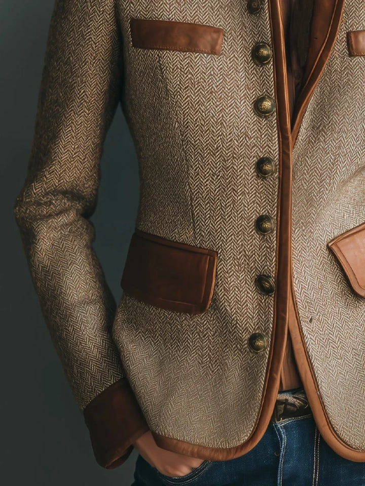 Detail of contrast trim on herringbone jacket pocket