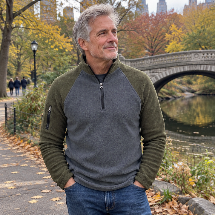 Man wearing a half-zip pullover in an autumn park