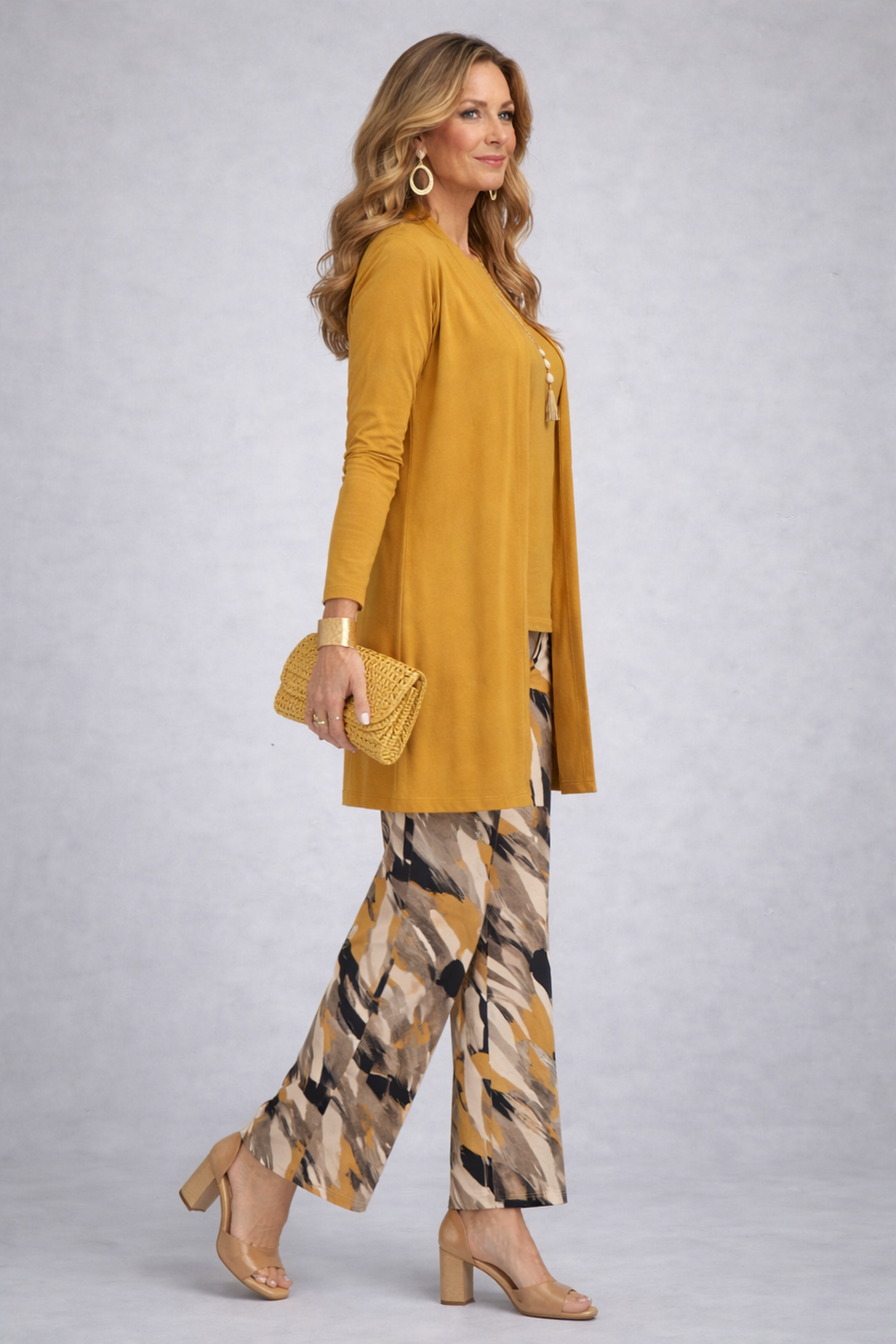 Another view of the mustard open-front cardigan and abstract print pant set