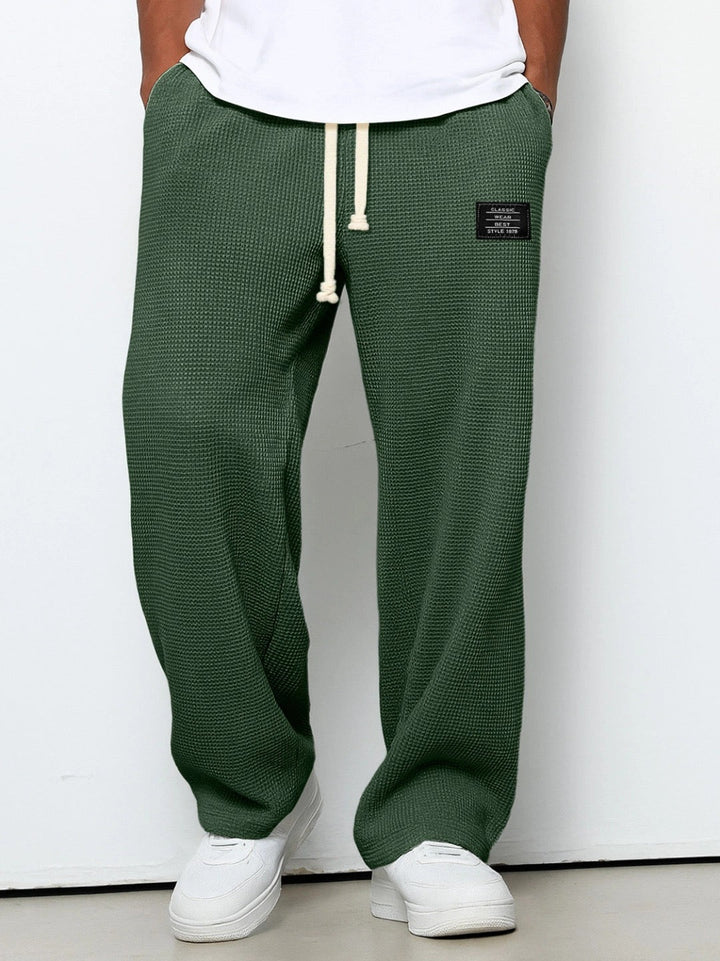Men's dark green relaxed wide-leg drawstring pants